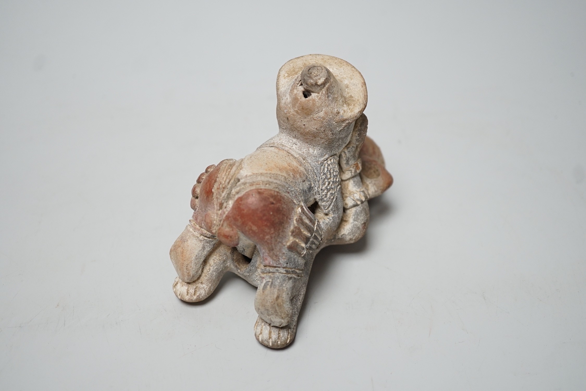 A Mayan or later biscuit earthenware erotic novelty whistle, 12cm long